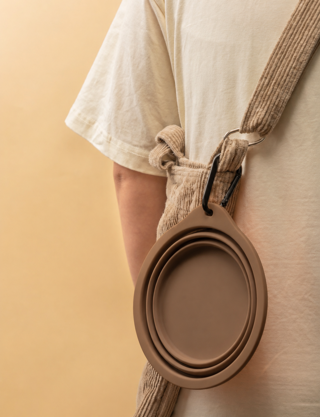 Portable brown collapsible silicone pet bowl for dogs and cats with carabiner clip