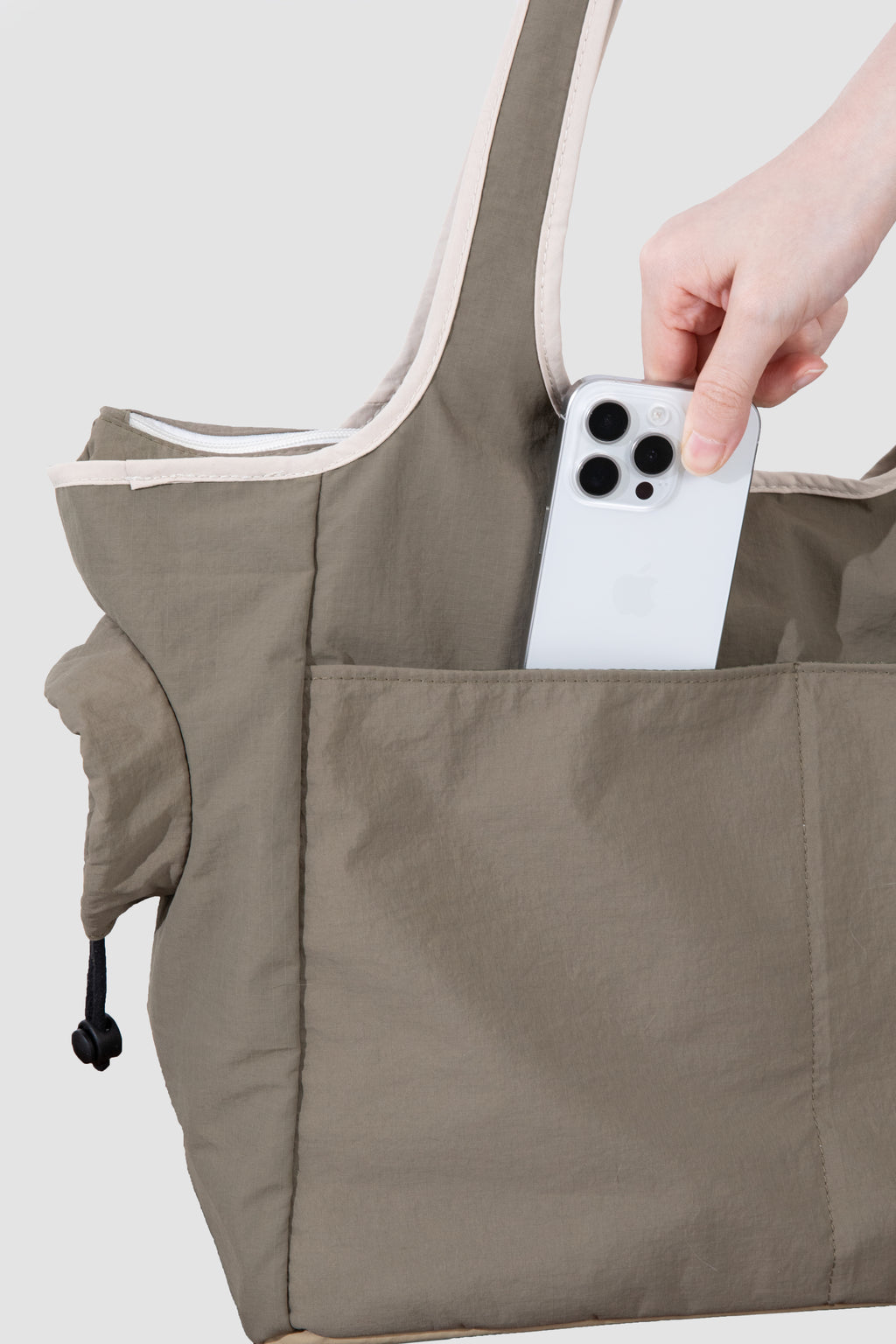 Storage pocket detail on a pet tote carrier bag