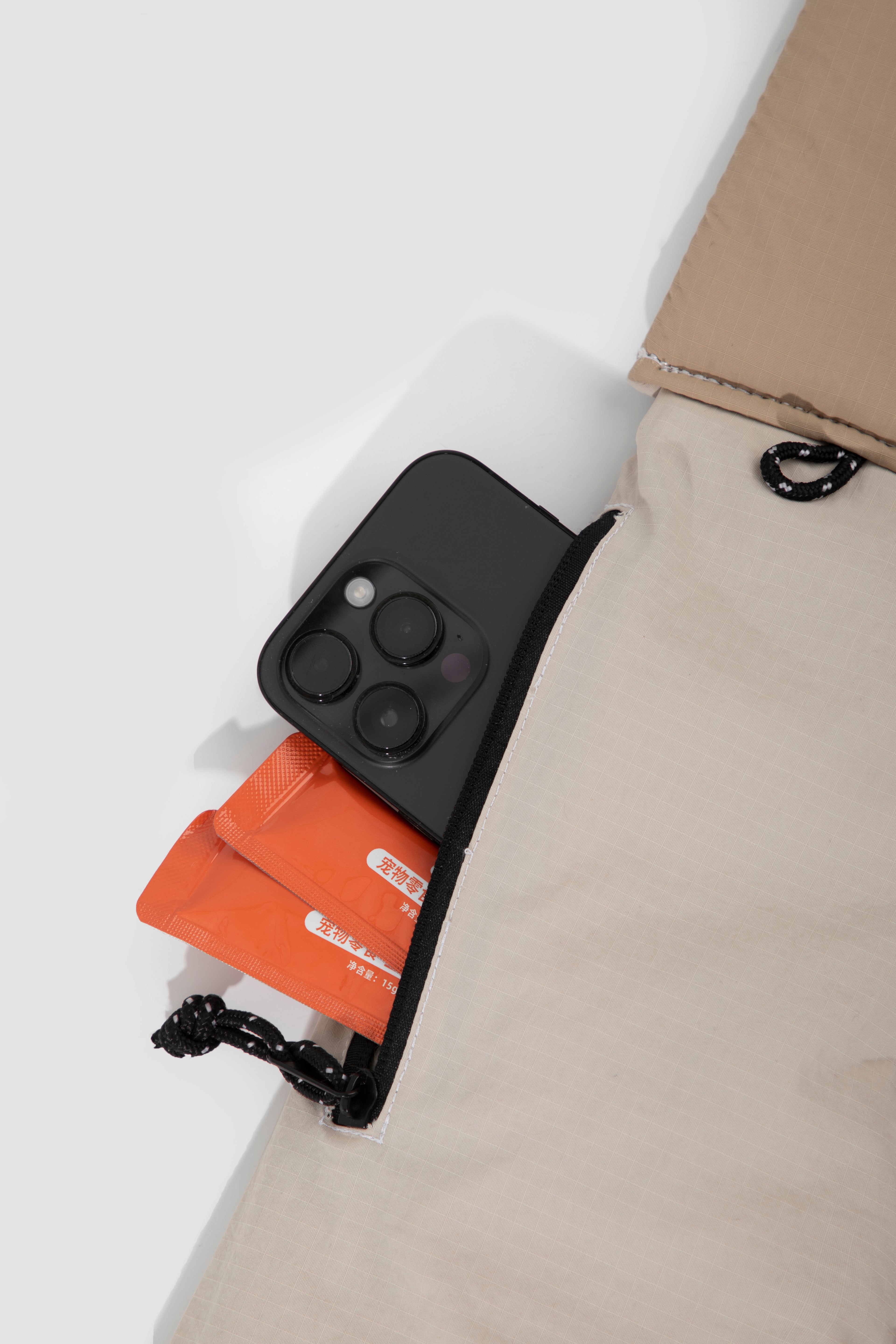 Phone storage pocket on a comfort pet sling carrier